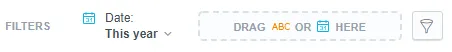Filter bar at the top of the Analytical Designer showing a filter on the date attribute set to This year. A placeholder indicates a field where another attribute can be dragged.
