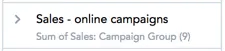 Renamed metric shown as sales online campaigns with the original metric sum of sales campaign group displayed in smaller text below it in the data catalog.