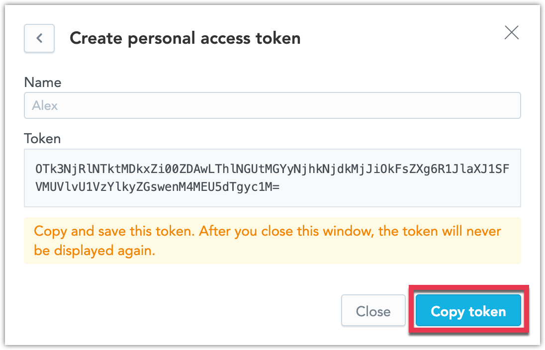 Create personal access token dialog displaying the newly generated token with a warning to copy and save it.