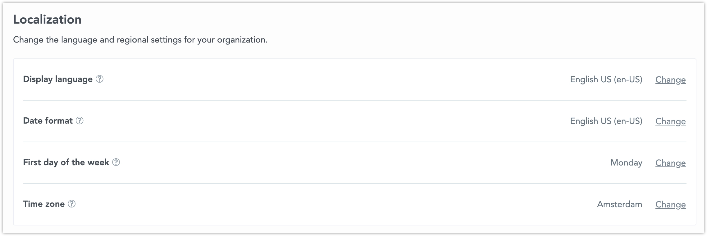 Localization section in the Settings tab displaying four configuration rows: display language, date format, first day of the week, and time zone. Each setting includes a Change button on the right side of its row.